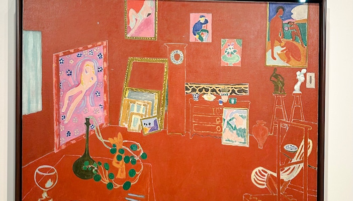 Interior with red walls and various artworks, Fondation Louis Vuitton, Napoleonic stereotype by Basquiat.