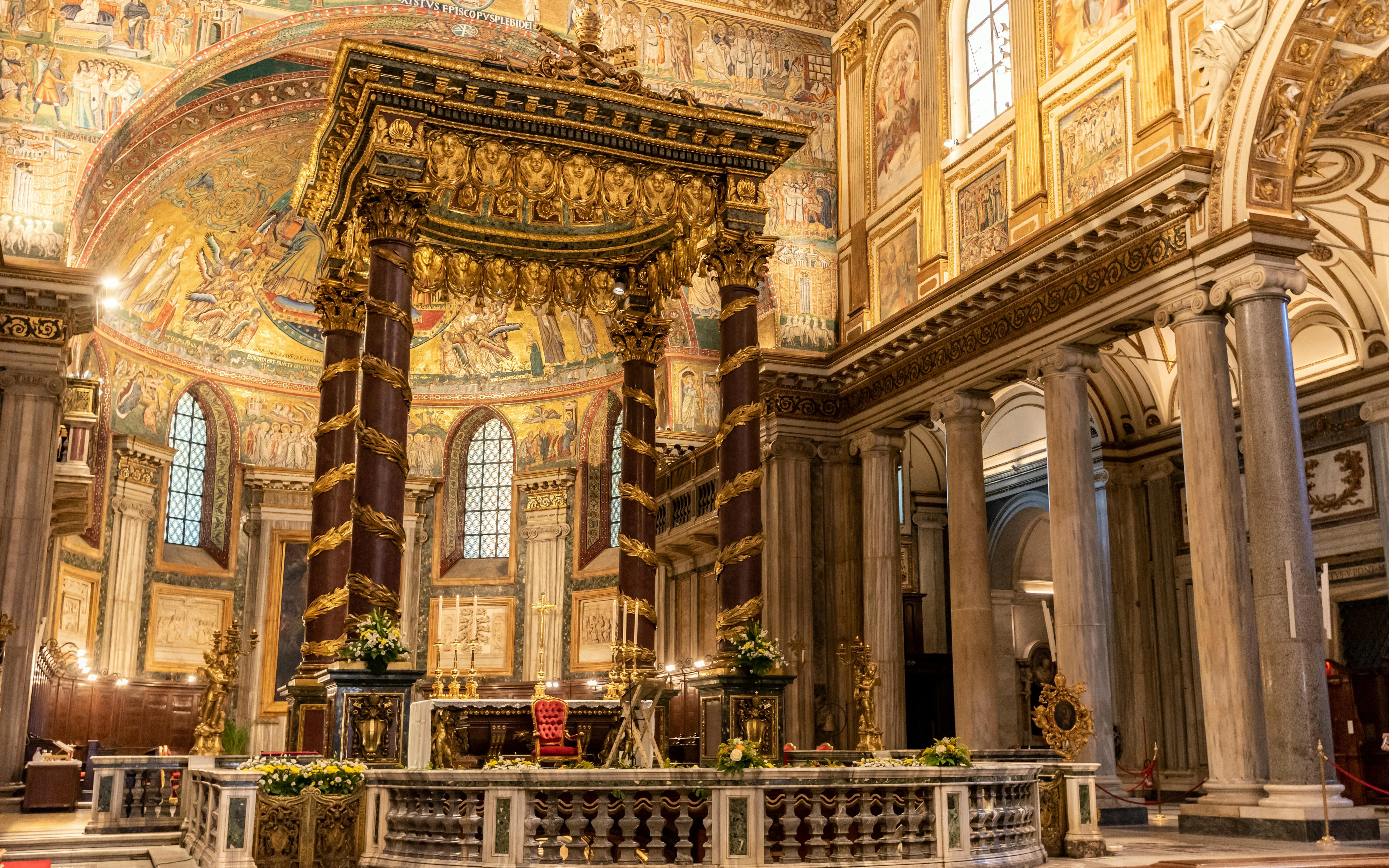Interior of the Pontifical Basilica of Santa Maria Maggiore, Rome, featuring ornate altar and frescoes.