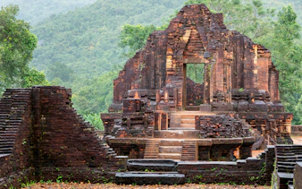 Ancient temple ruins with intricate carvings at My Son Sanctuary, Vietnam.