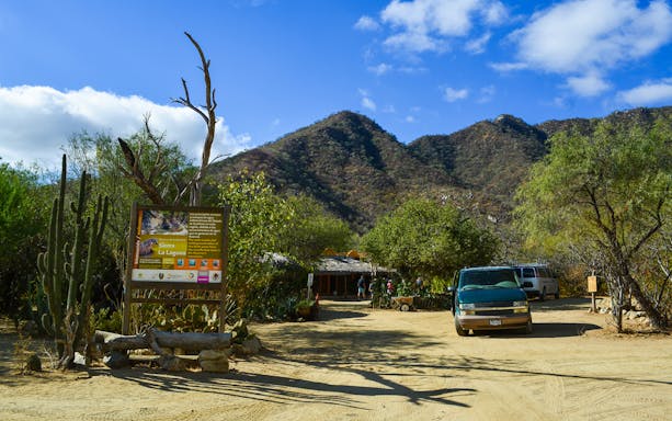 Hikers exploring Fox Canyon trail in Los Cabos, Mexico on a guided tour.