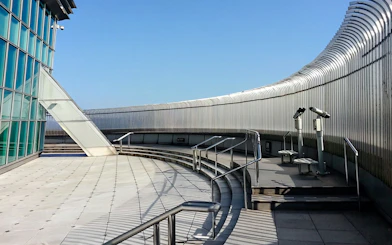 Observation deck of Taipei 101 with telescopes and glass panels.