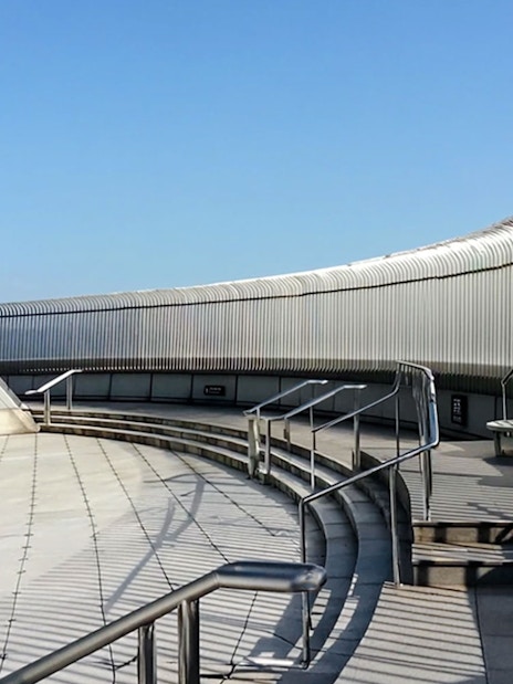 Observation deck of Taipei 101 with telescopes and glass panels.
