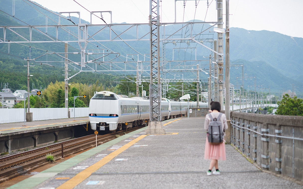 Thunderbird train arriving at a station in Japan with JR Pass.
