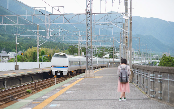 Thunderbird train arriving at a station in Japan with JR Pass.