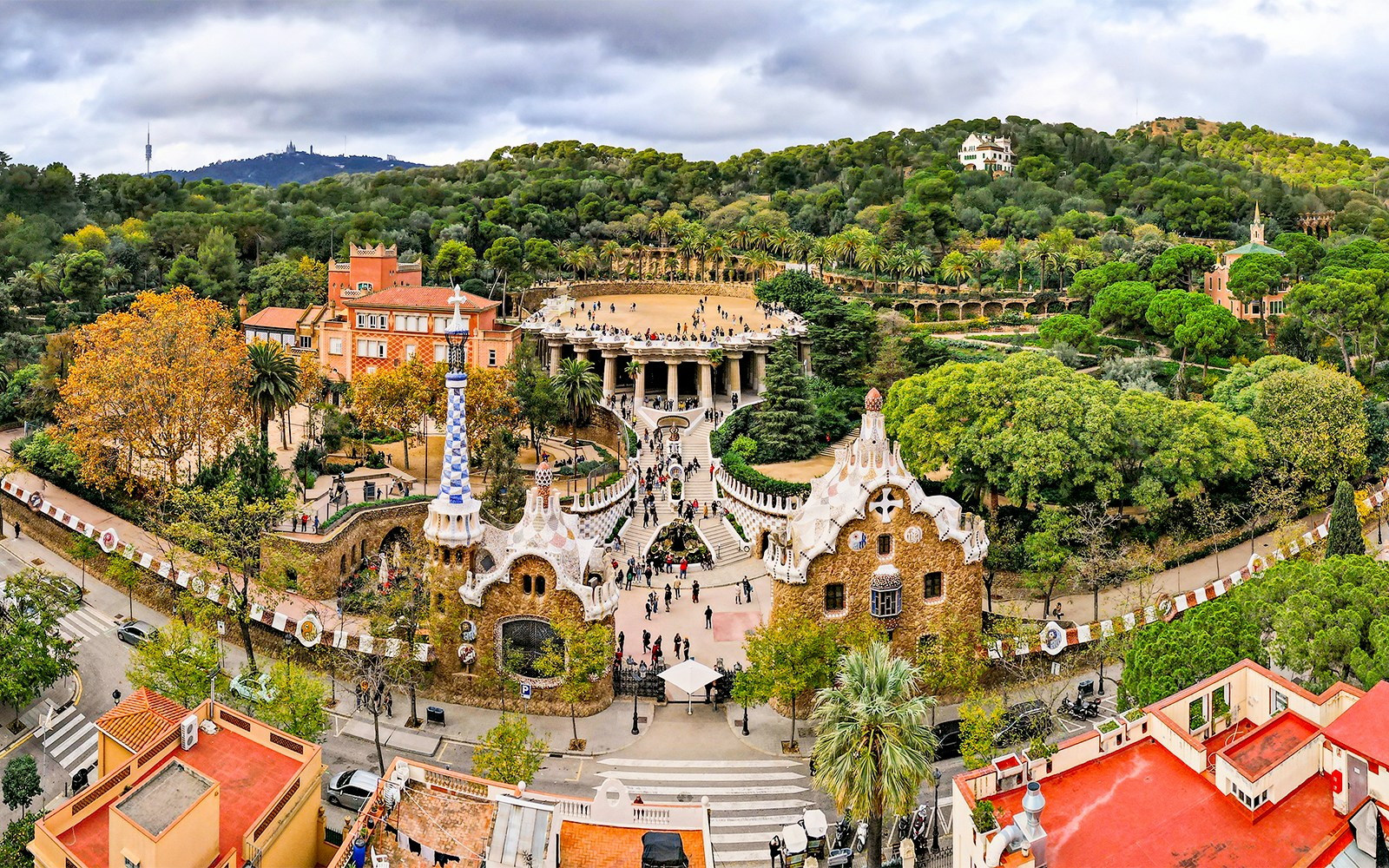 Colorful mosaic structures in Park Guell, Barcelona, showcasing Gaudi's architectural style.