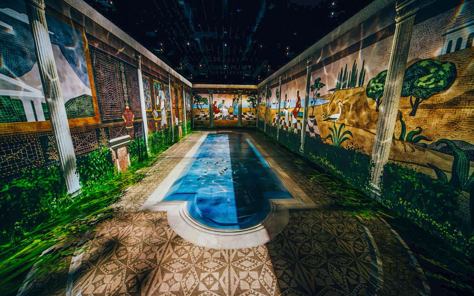Mosaic murals depicting ancient Pompeii scenes with a central pool.