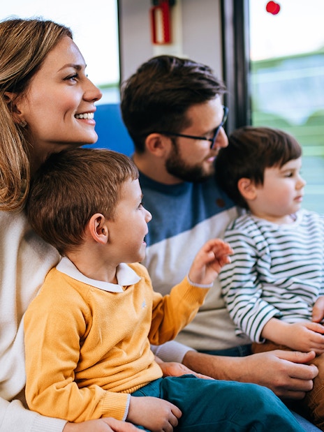 Family enjoying a scenic coach transfer journey.