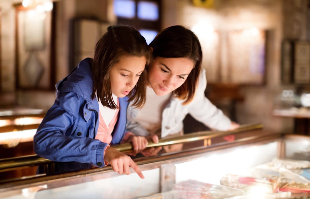 Children exploring exhibits in a museum.