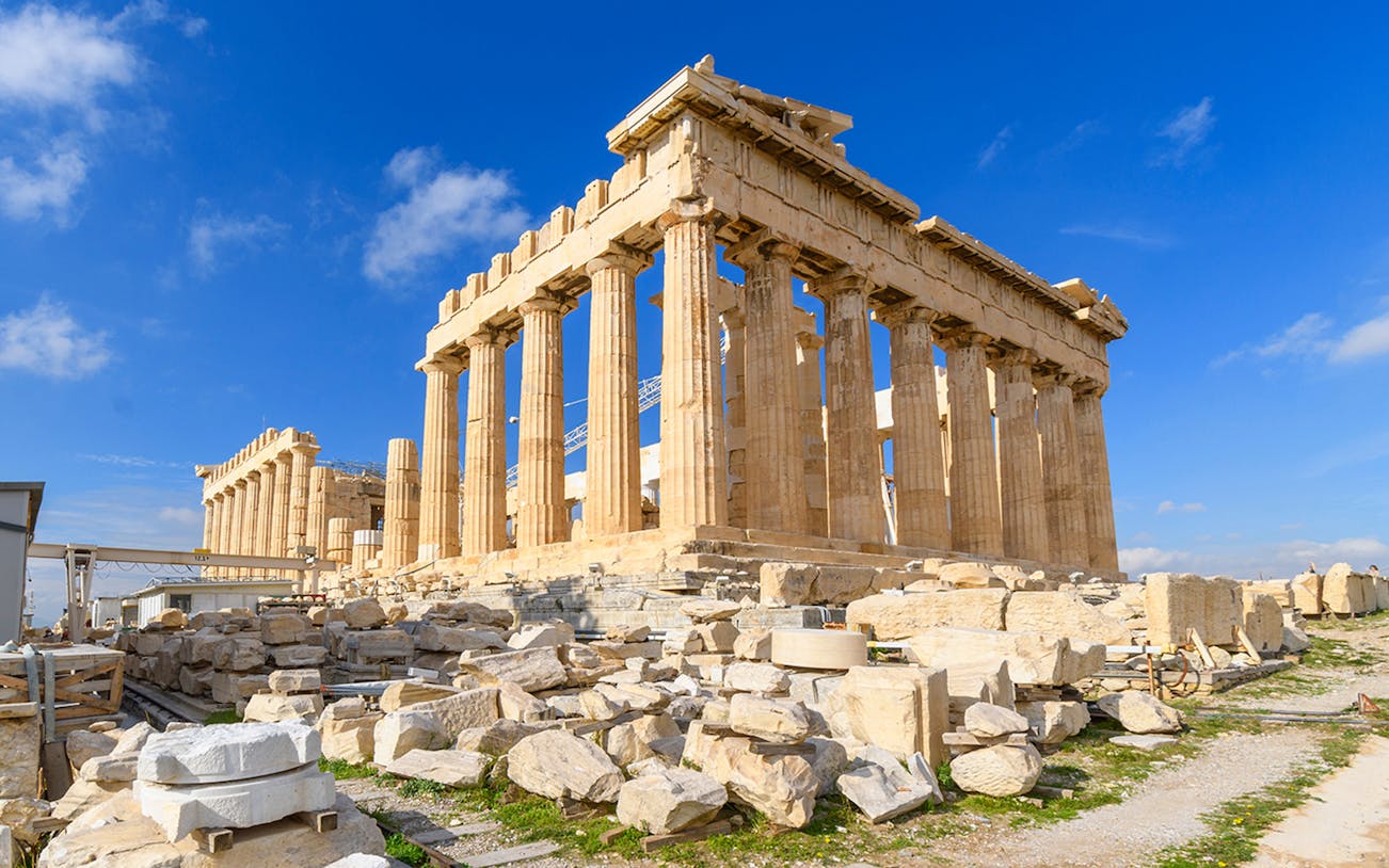 Parthenon temple on the Acropolis in Athens under a clear blue sky.