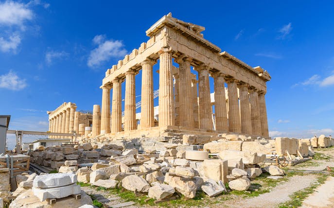 Parthenon temple on the Acropolis in Athens under a clear blue sky.