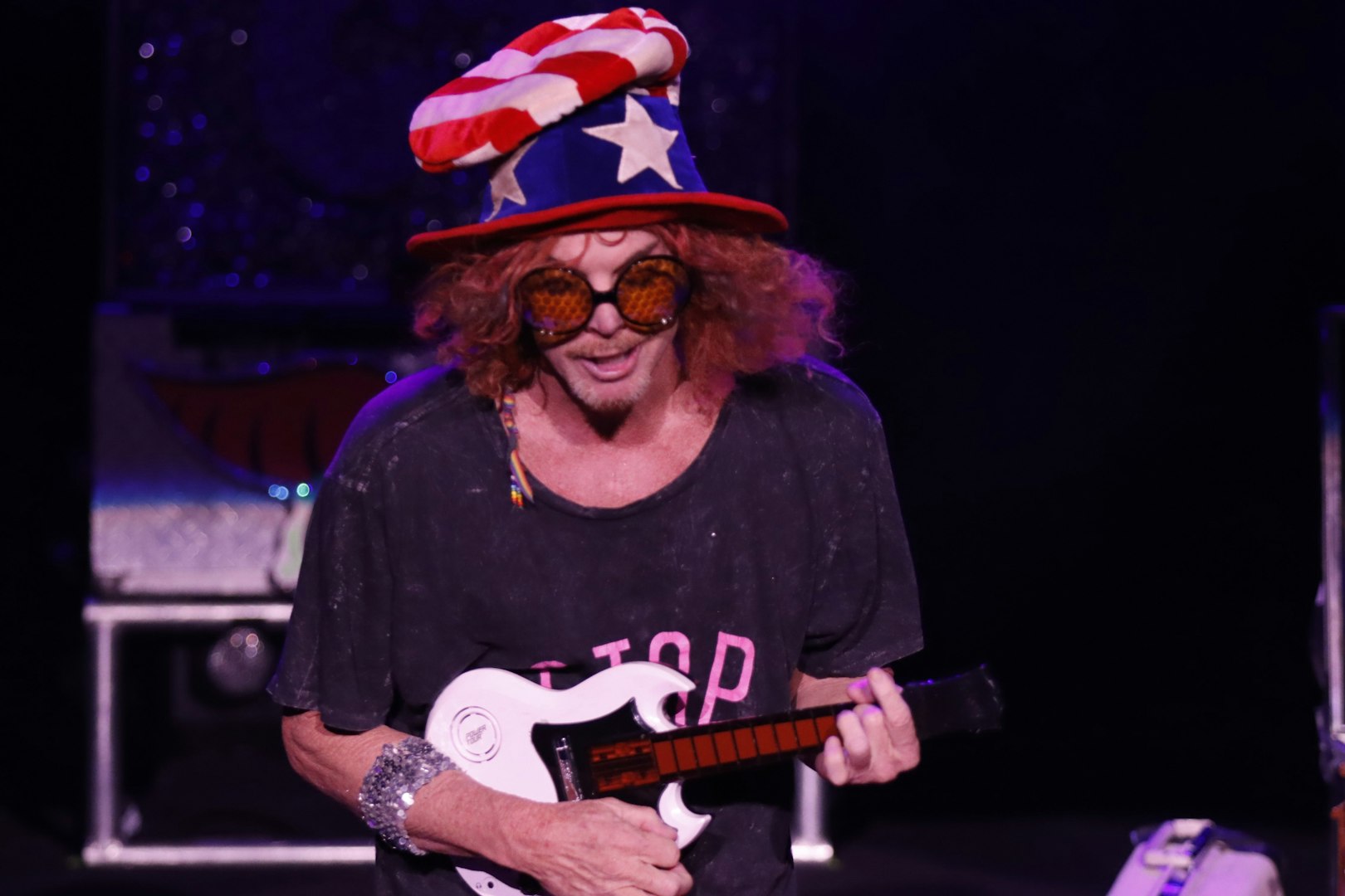 Performer with a prop guitar at Carrot Top show in Las Vegas.