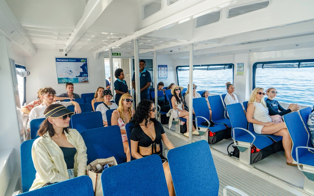 Guests enjoying the Ride and Slide Catamaran by South Sea Cats in Fiji.