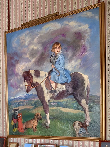 Paintings in Liria Palace featuring a man with a dog and a child on a horse.