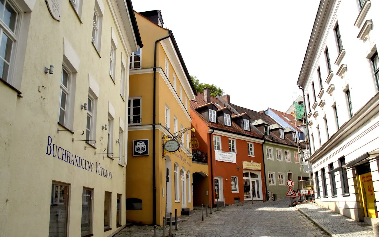 Street view of colorful buildings in Dachau town, Germany, part of a guided day trip from Munich.