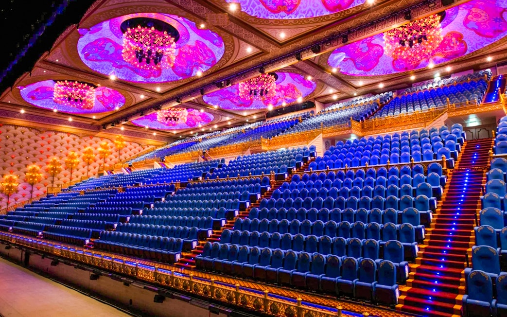 Grand theater seating with ornate ceiling at Carnival Magic Phuket.