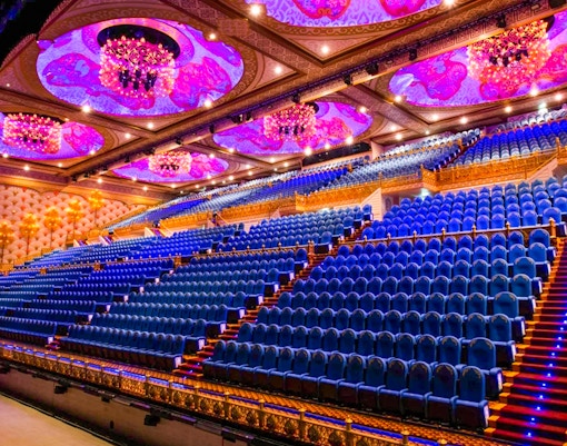 Phuket Carnival Magic parade with vibrant floats and performers in traditional costumes.