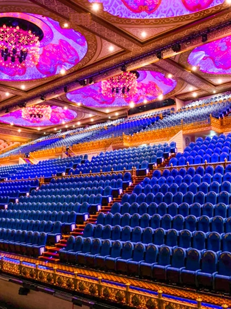 Grand theater seating with ornate ceiling at Carnival Magic Phuket.