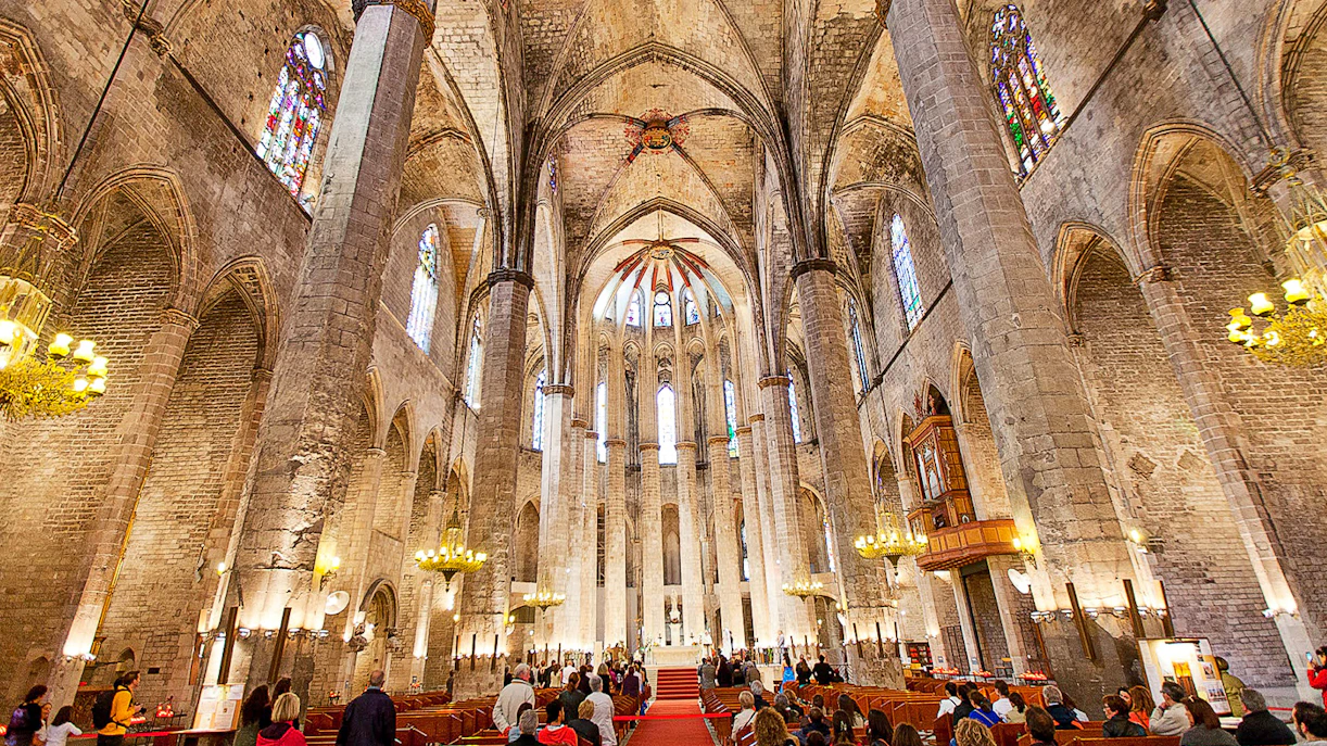 Interior of Santa Maria del Mar with visitors on a guided tour, Barcelona.
