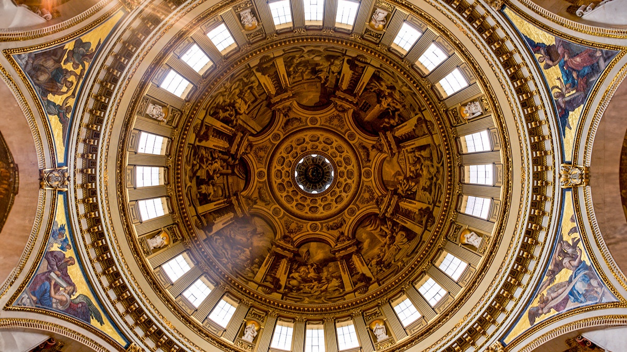 Intricate frescoes and architectural details on St. Paul's Cathedral dome, London.