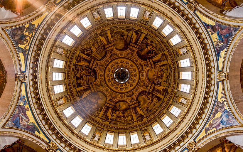 Intricate frescoes and architectural details on St. Paul's Cathedral dome, London.