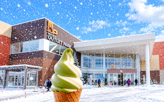 Mitsui Outlet Park in winter with matcha ice cream cone, Hokkaido tour.
