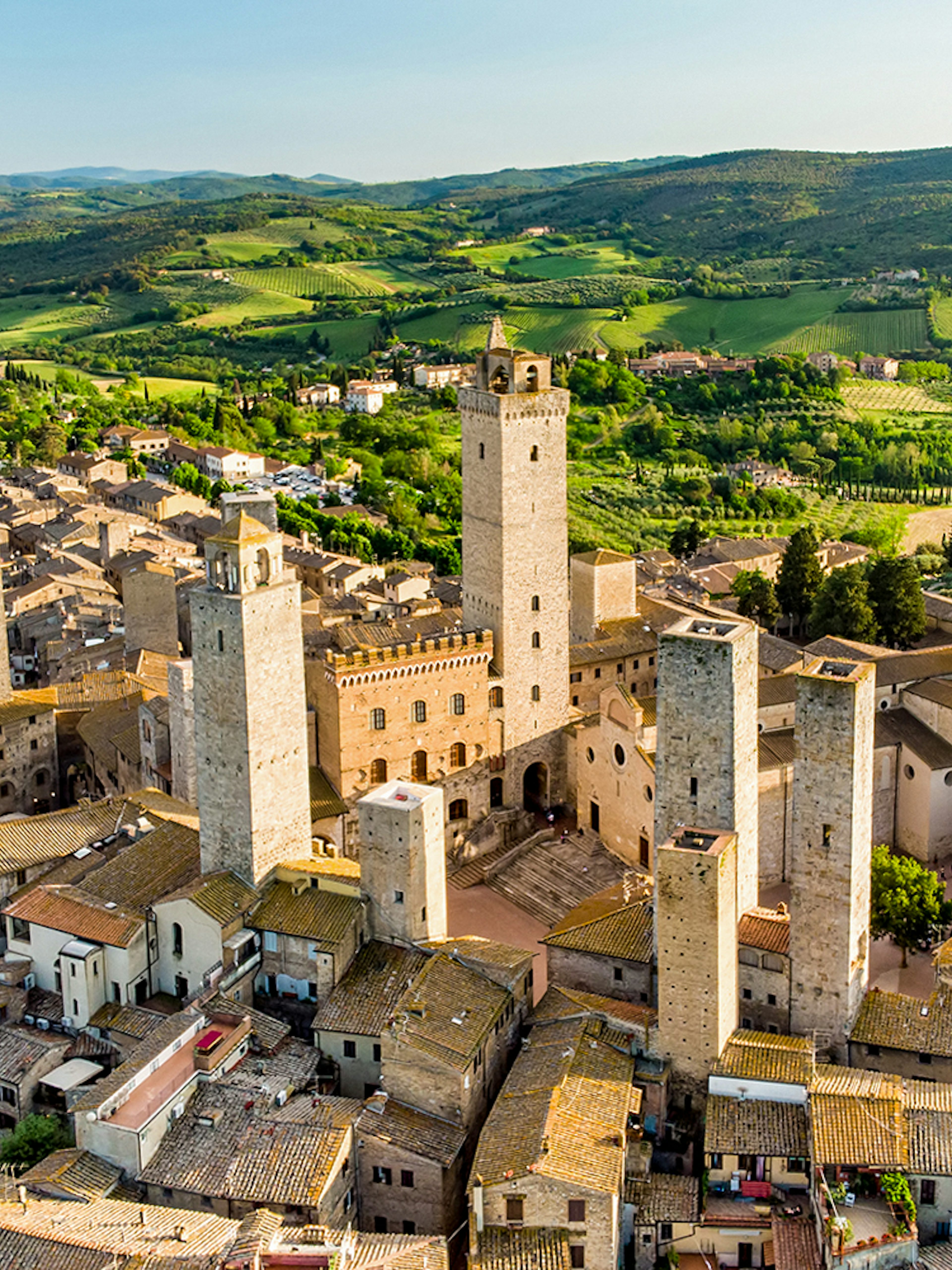 Aerial view of San Gimignano's medieval towers, including Torre Grossa, in Tuscany, Italy.