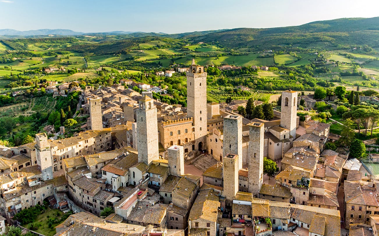 Aerial view of San Gimignano's medieval towers, including Torre Grossa, in Tuscany, Italy.