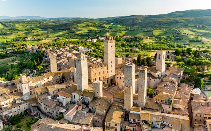 Aerial view of San Gimignano's medieval towers, including Torre Grossa, in Tuscany, Italy.