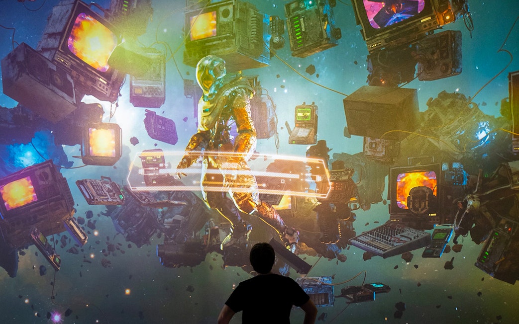 Guests viewing digital art installation at ARTECHOUSE New York.