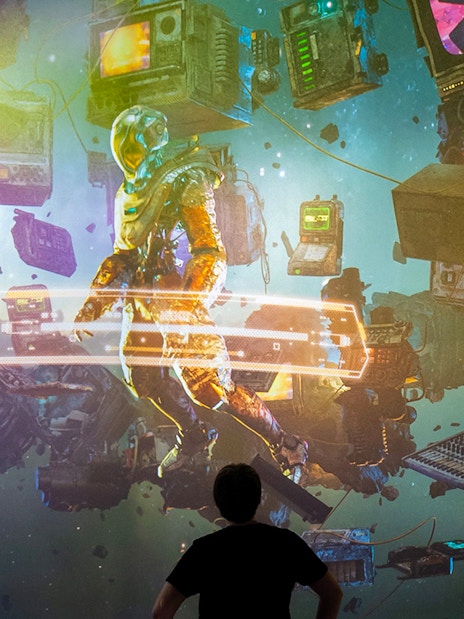 Guests viewing digital art installation at ARTECHOUSE New York.