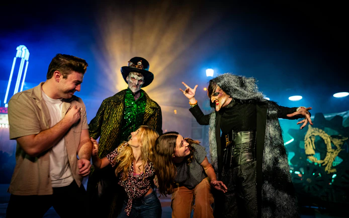 Visitors interacting with costumed performers at Canada's Wonderland Halloween Haunt.