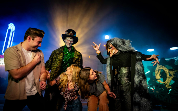Visitors interacting with costumed performers at Canada's Wonderland Halloween Haunt.