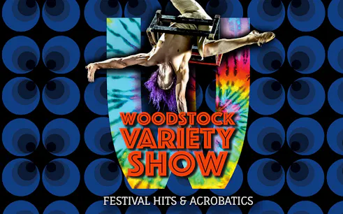 Performer in acrobatic pose at Woodstock Variety Show with colorful backdrop.