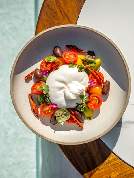 Burrata salad with cherry tomatoes and olives at Yona Beach Club, Phuket.