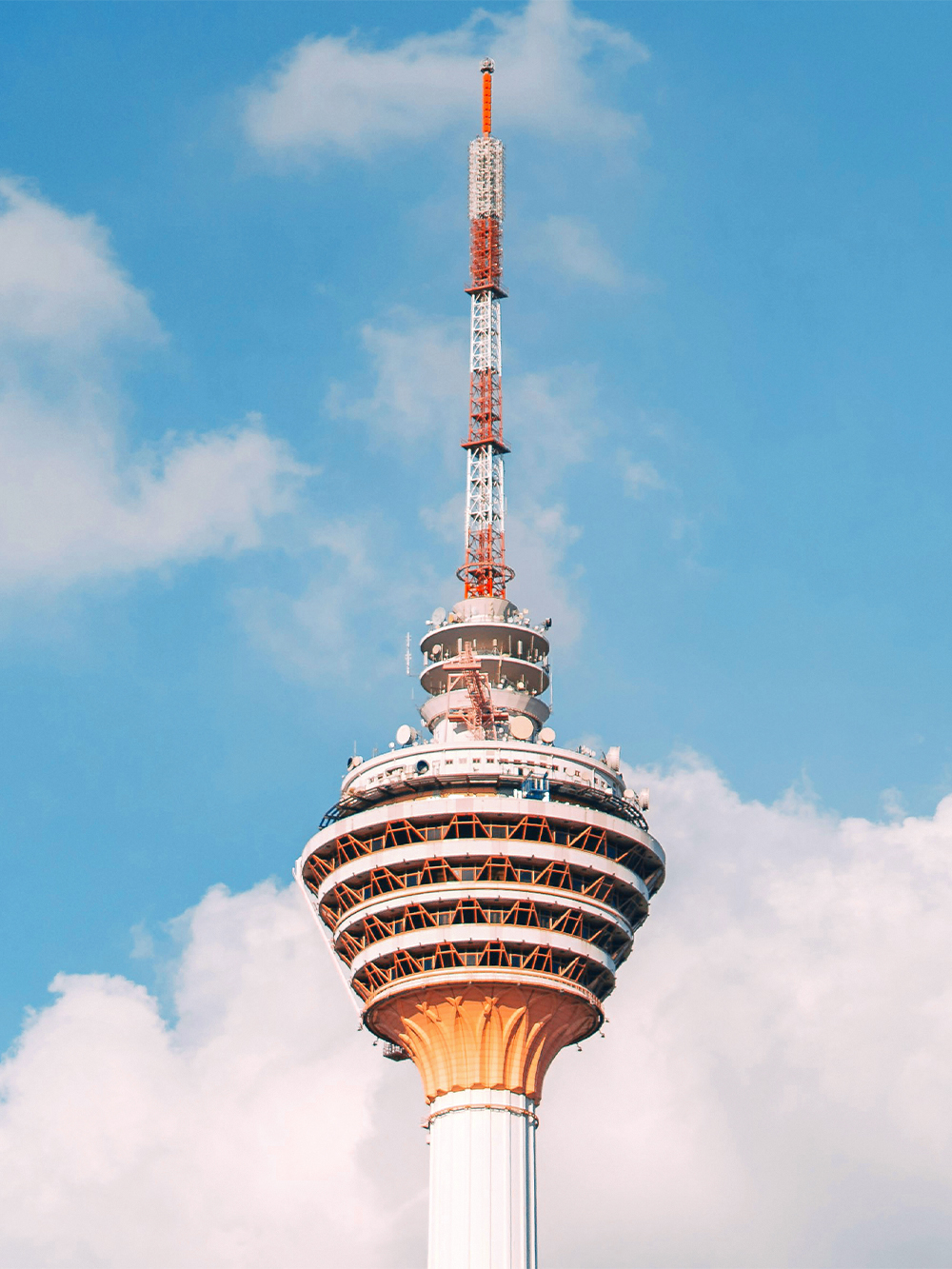 KL Tower with ARAS Revolving Restaurant against blue sky, Kuala Lumpur.