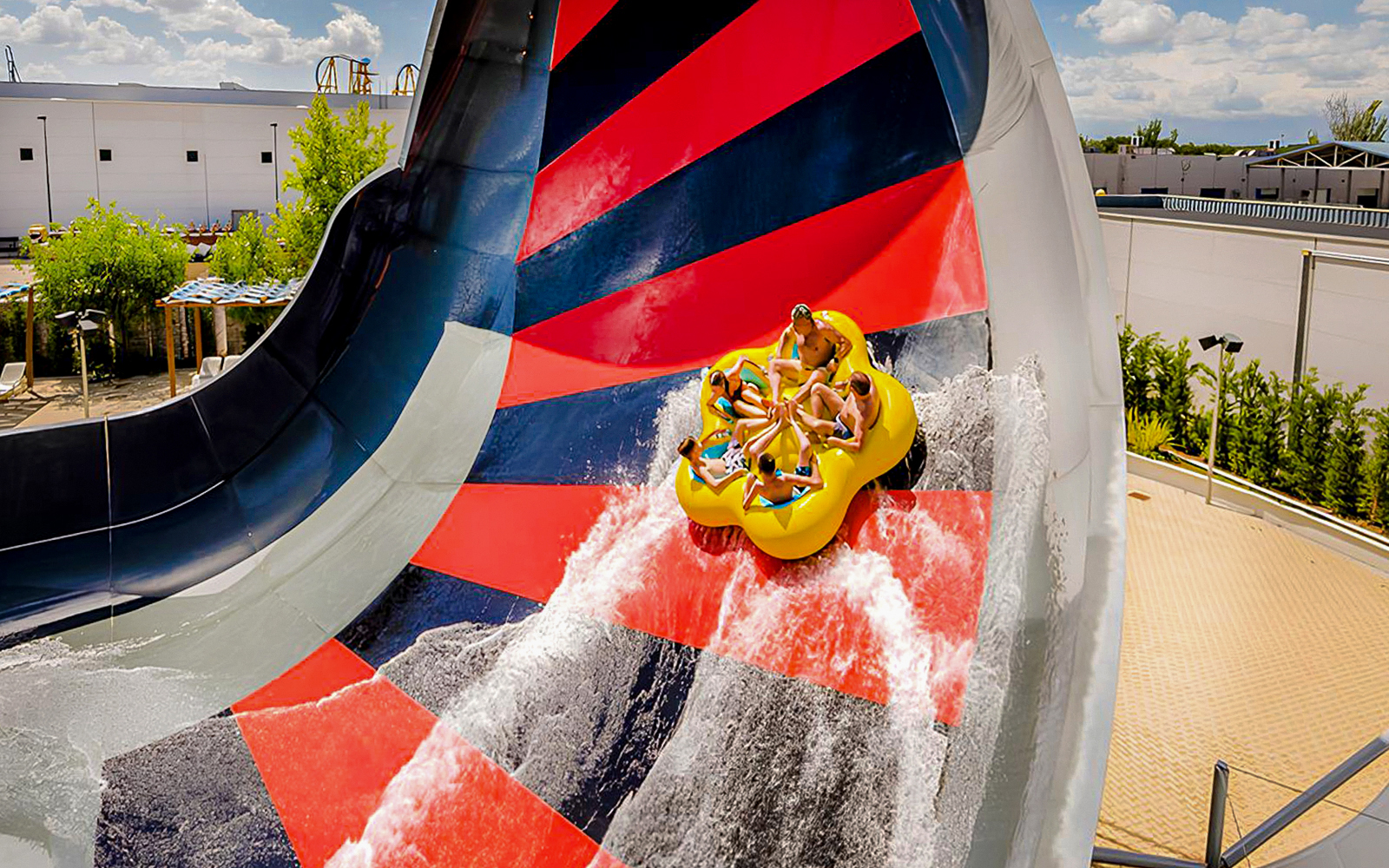 Visitors on a raft slide at Parque Warner Beach, Madrid.