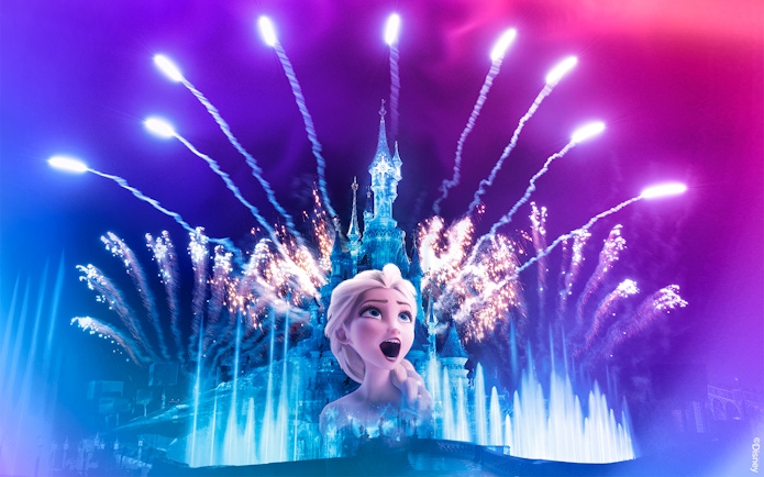 Fireworks over Sleeping Beauty Castle at Disneyland Paris with character projection.