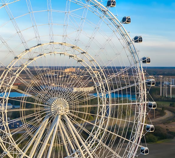 Ferris wheel at Icon Park, Orlando, with cityscape in the background.