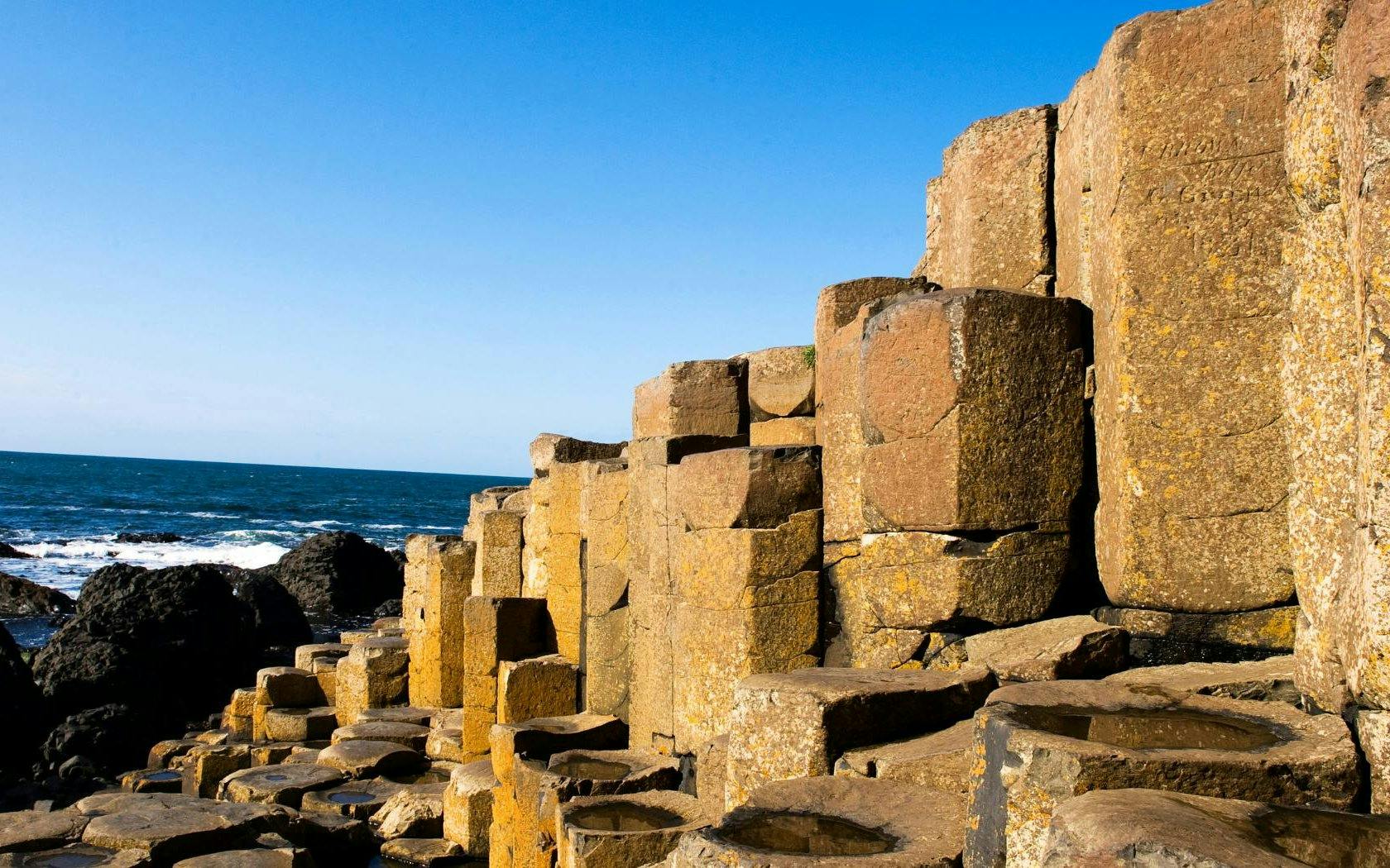 Giant's Causeway basalt columns by the sea in Northern Ireland.