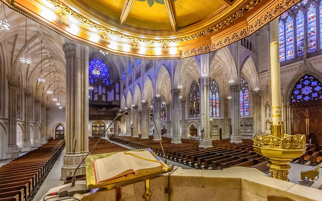 St. Patrick's Cathedral interior with stained glass windows and pulpit, New York City.