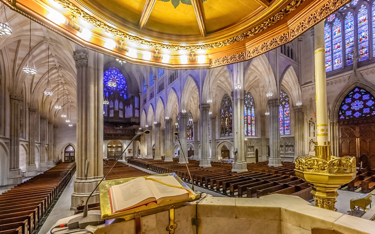 St. Patrick's Cathedral interior with stained glass windows and pulpit, New York City.