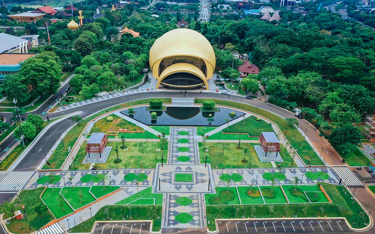 Aerial view of Taman Mini Indonesia's iconic dome and gardens in Jakarta.