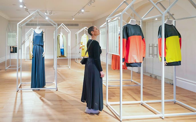 Visitor exploring exhibits at Porto Fashion and Fabric Museum.