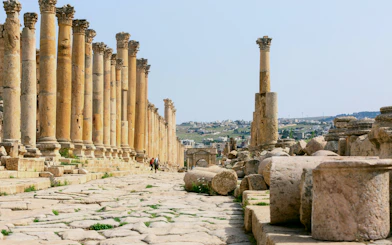 Ancient columns lining the Cardo Maximus in the Roman Ruins of Jerash, Jordan.
