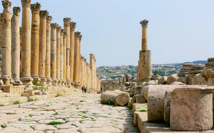 Ancient columns lining the Cardo Maximus in the Roman Ruins of Jerash, Jordan.