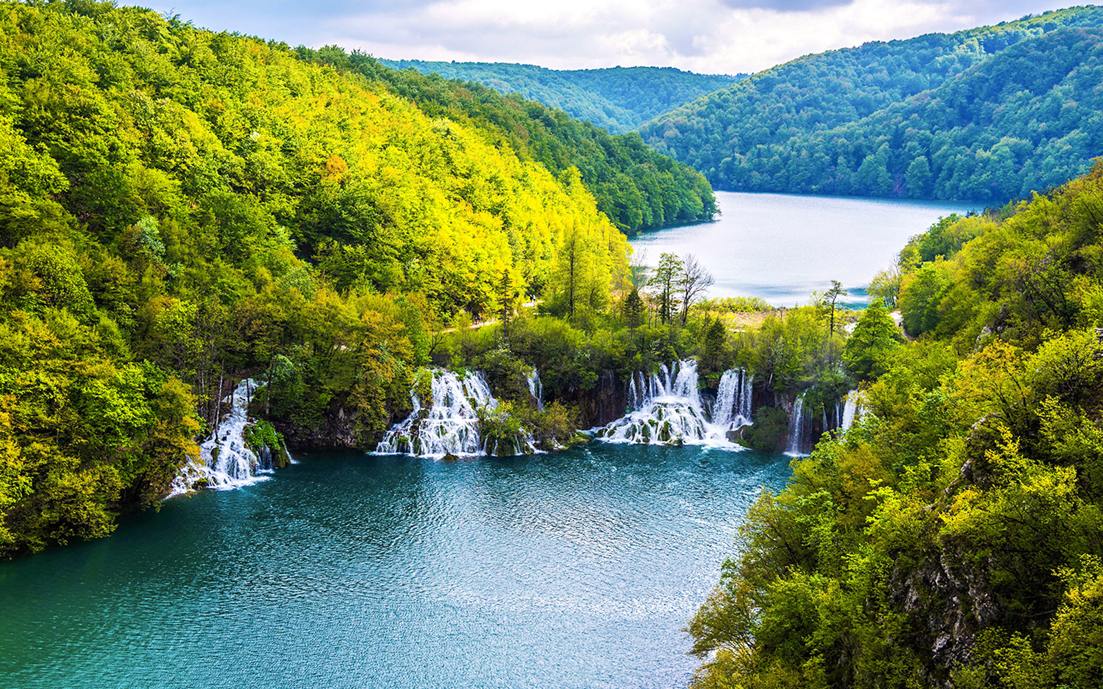 Waterfalls and lush greenery at Plitvice Lakes National Park, Croatia.