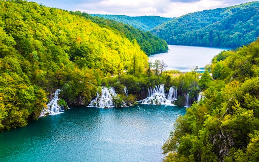 Waterfalls and lush greenery at Plitvice Lakes National Park, Croatia.