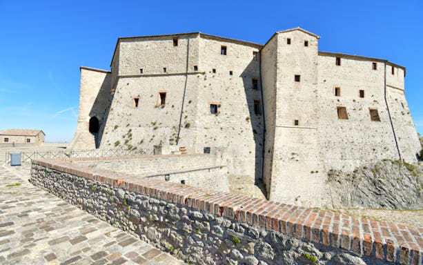 San Leo Fortress exterior with stone walls and entrance, Italy.