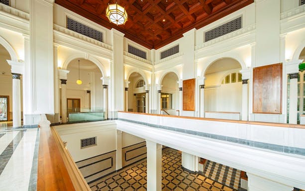 National Gallery Singapore interior with arches and checkered floor.