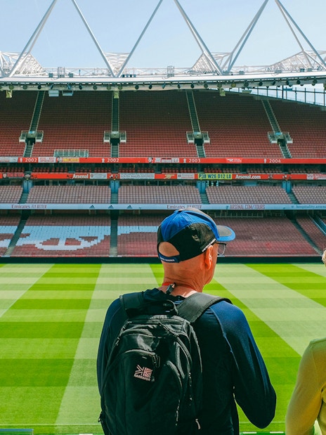 Visitors overlooking the field at Emirates Stadium, London.